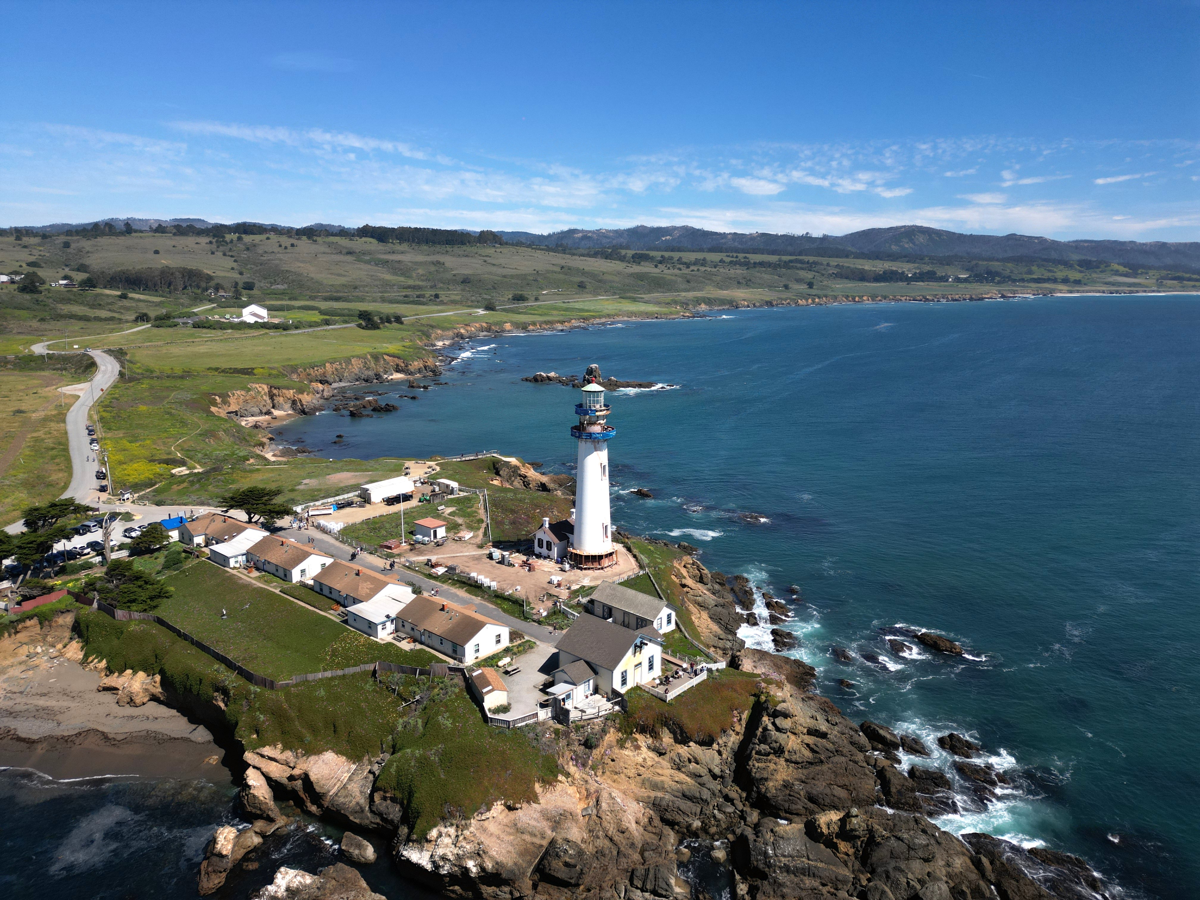 Aerial view of Pigeon Point Light Station State Historic Park with Cloverdale Bluffs off in the distance. Photo from Matthew Huang, Peninsula Open Space Trust.